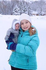 child and doll in winter
