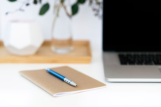 Close-up of pen on book at desk in office