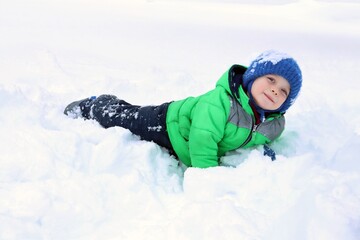 child playing in snow