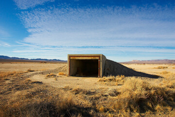 Located in the middle of Frenchman Flat is a concrete and metal parking structure, it was built to see if it could stand a nuclear war.