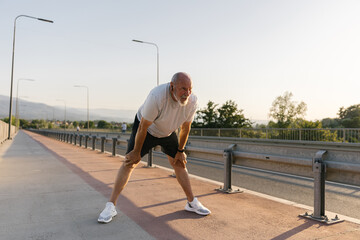 Senior Athlete Catching His Breath After Running