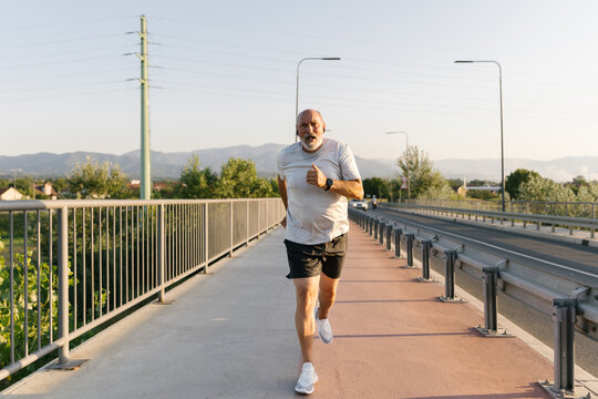 Senior Athlete Focused On His Running Workout