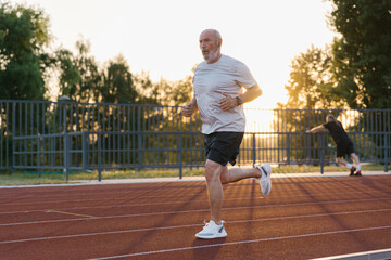 Boomer Athlete Having A Cardio Training On A Track