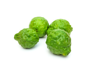 Fototapeta premium Fresh organic kaffir lime green, rough skin, kaffir lime has many uses. commonly used as a shampoo Or kaffir lime skin can be used as an ingredient in food. put on a white background.