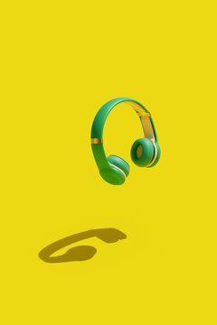 3D rendering blue headphones on a yellow background 