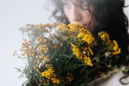 Floral portrait of woman smell flowers