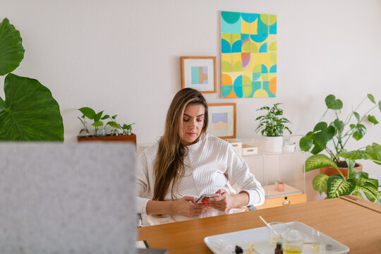 Wellness coach woman entrepreneur working from home office