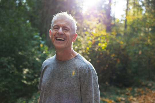 Portrait Of Happy Athletic Runner Outside During Workout.