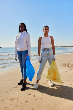 Diverse volunteers with plastic bags