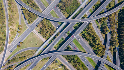 Aerial drone view above the Light Horse Interchange in Sydney, NSW Australia at the junction of the M4 Western Motorway and the Westlink M7 - obrazy, fototapety, plakaty