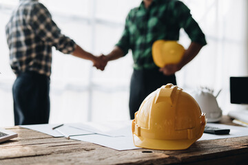 Construction worker team hands shaking greeting start up plan new project contract in office center...