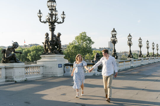couple on a bridge in Paris