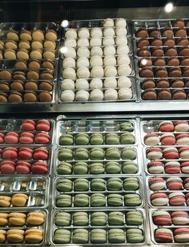 UGC, rows of colourful macarons in the market