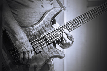electric guitar, bass being played