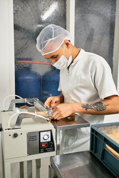 Operator packaging sweet milk cheese