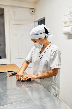 Working woman folding paper