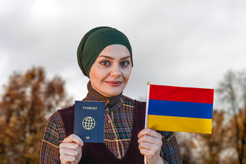 Muslim Woman Holding Passport and Flag of Armenia
