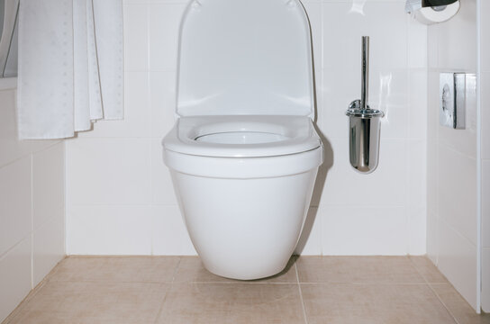 white toilet with open door