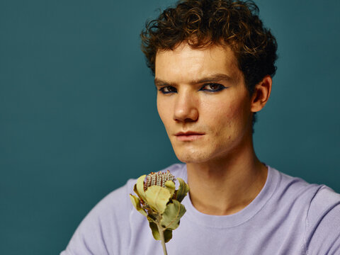 Dramatic portrait with weird flower