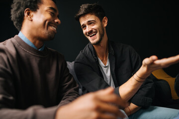 Two Men Watching Match at Home