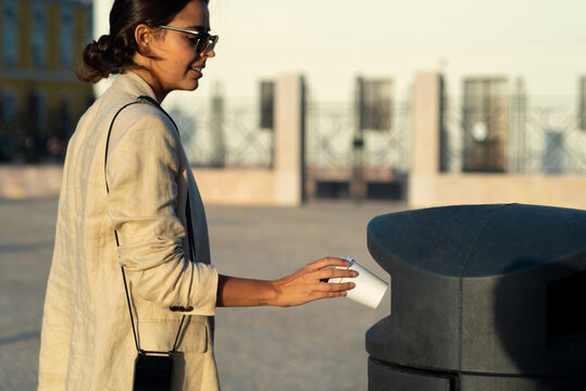 Woman sustainable practice disposing litter