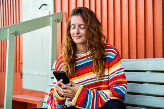 Woman using phone outdoors
