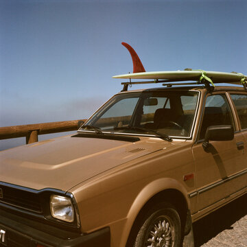 Vintage car with surfboard