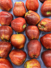 Red apples at a market stand