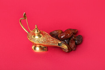 Aladdin lamp of wishes and dates for Ramadan on red background