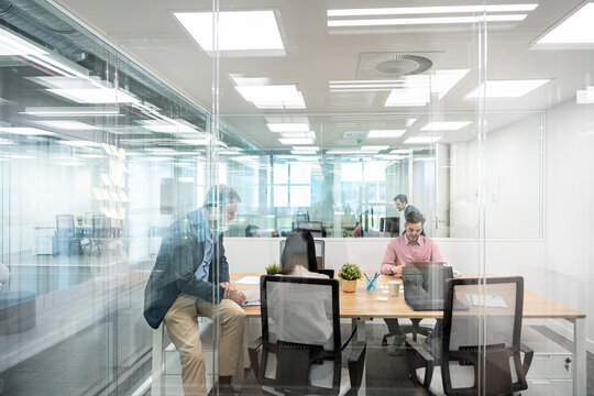 Businesspeople Working in Bright Workspace Office