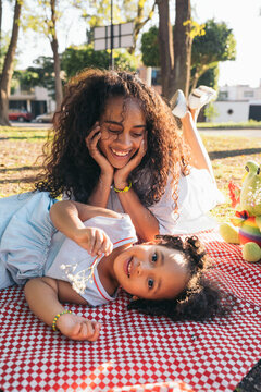 Mom And Daughter Playing In A Park