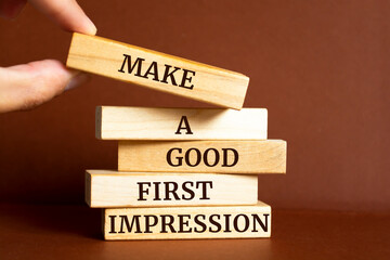 Wooden blocks with words 'Make a Good First Impression'.