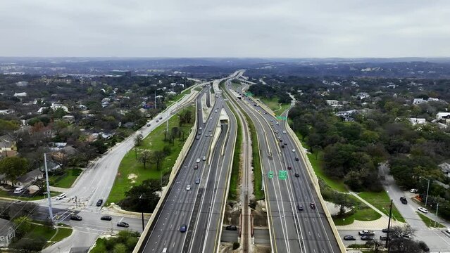 Flying over traffic on interstate 1, cloudy autumn day in Austin, USA - Aerial view