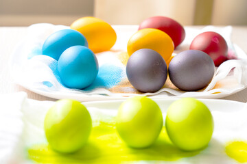 Painted eggs on the table after painting, a symbol of Easter, eggs 
