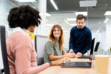 Happy Coworkers Talking in the Office