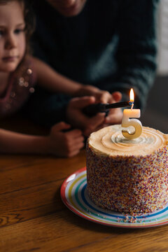 Birthday cake with lit candles