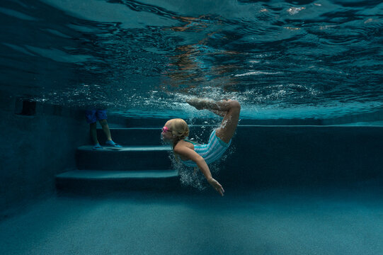 Girl flipping in the water