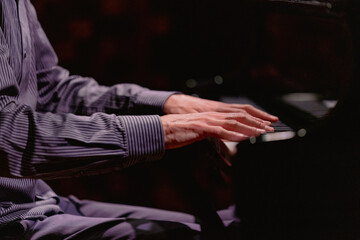 Hands close-up with a musical instrument