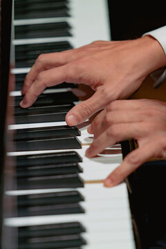 Hands close-up with a musical instrument