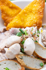 Pork noodles, meatballs, and fresh vegetables and warm soup . delicious food of Asian people.