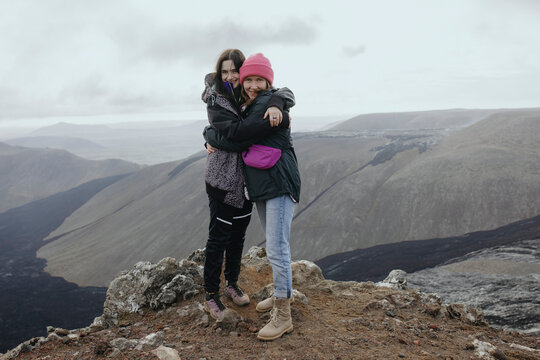 Scenery View Of two young girls looking on volcano in Iceland
