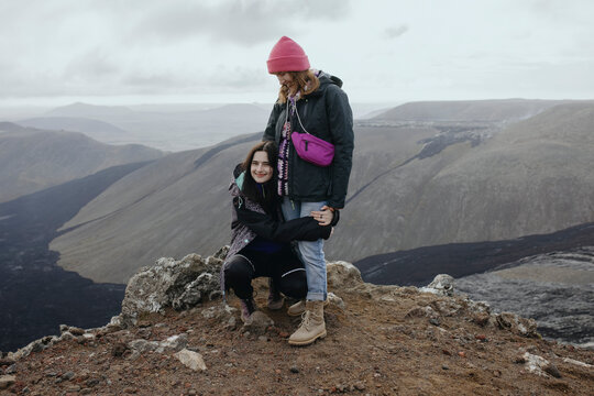 Scenery View Of two young girls looking on volcano in Iceland