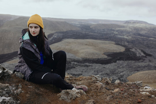 Scenery View Of young Women looking on volcano in Iceland