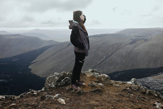 Scenery View Of young Women looking on volcano in Iceland