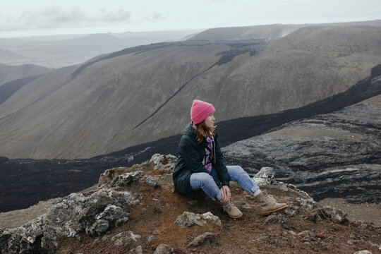 Scenery View Of young Women looking on volcano in Iceland