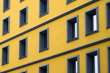 Series of windows on yellow building