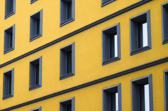 Series of windows on yellow building
