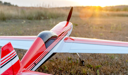 Naklejka premium airplane model on the runway at sunset