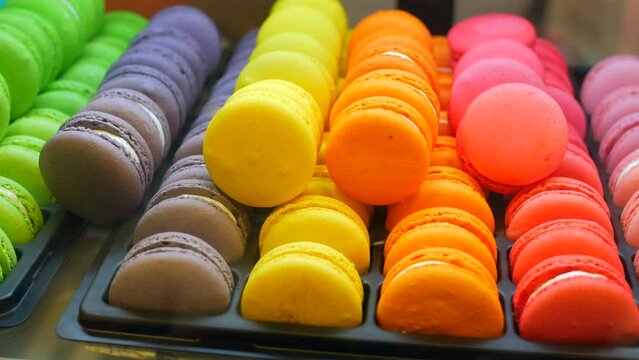 Close up of macaroon on blue background with copy space 