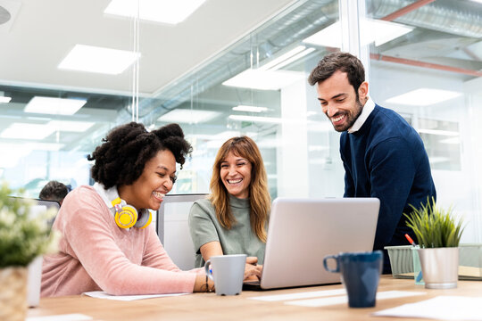 Happy Coworkers Talking in the Office